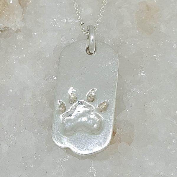 Sterling silver paw print necklace, custom made by Ron Emanuel
