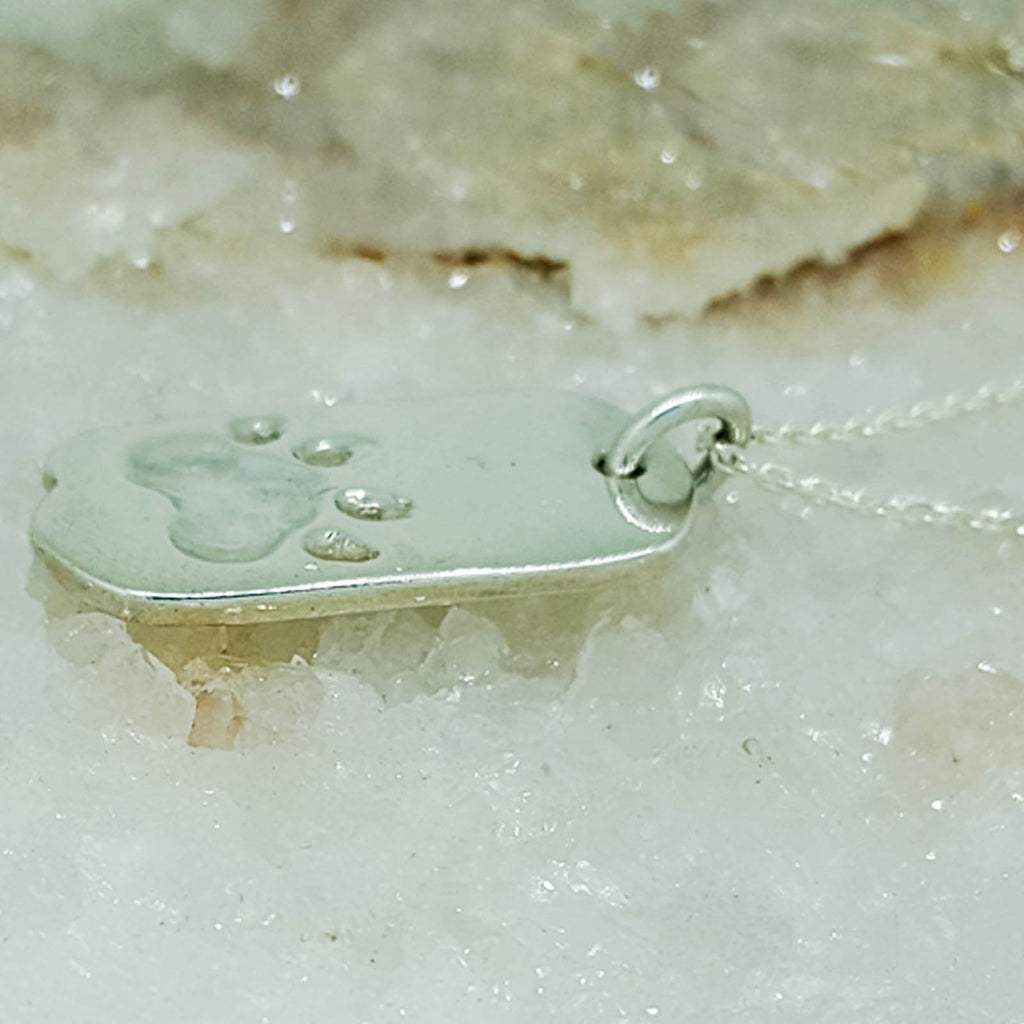 Sterling silver paw print necklace, custom made by Ron Emanuel